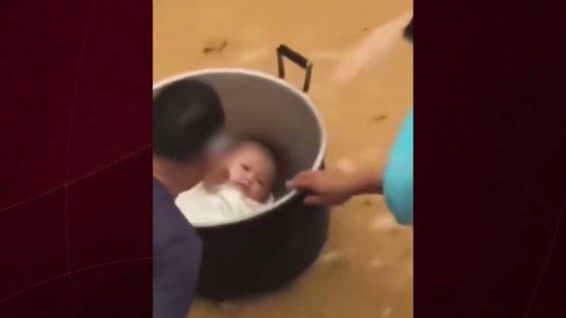 The father who was stranded in flood waters in China saved his baby with a pot and Latest Developments